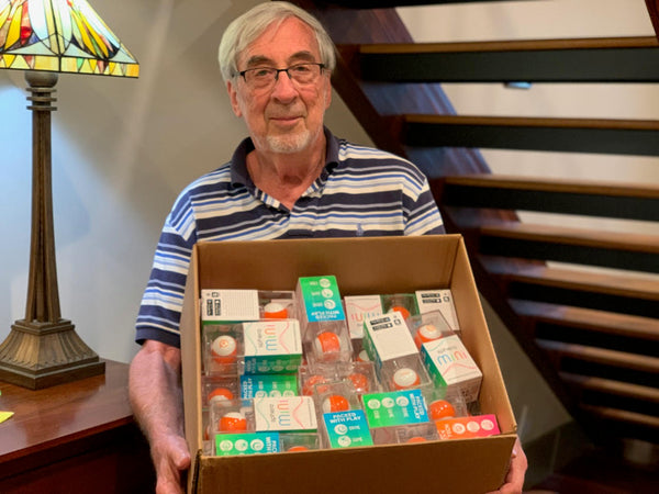 A box full of Sphero Minis.