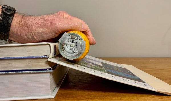 A physics experiment using the Sphero Mini rolling down an in incline.