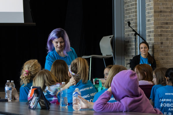 A group of girls learning in a STEM classroom.
