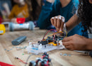 Magnified view of student working on Sphero RVR Mounting Plate with different circuits.