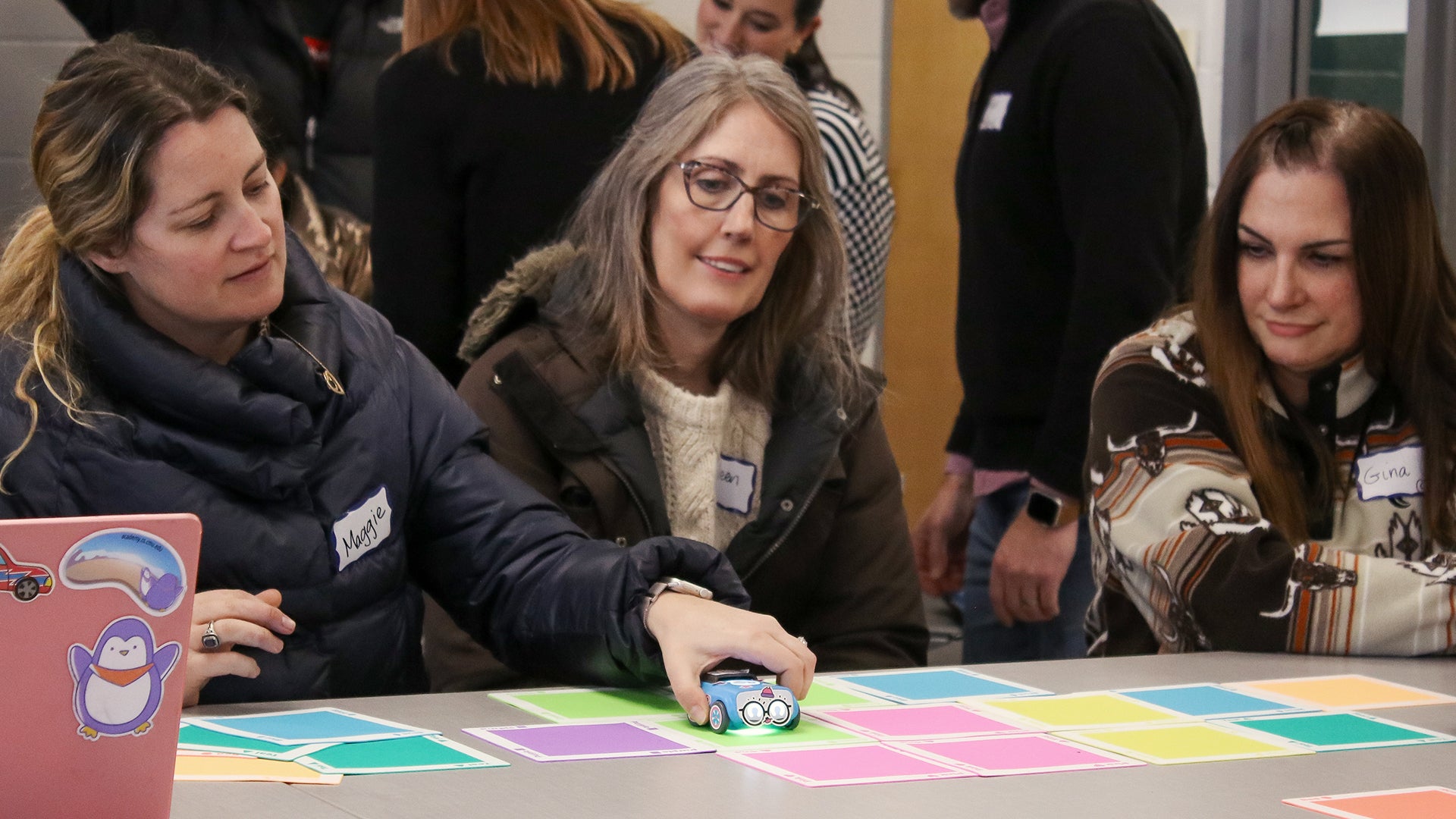Educators participating in a hands-on Sphero STEM symposium session