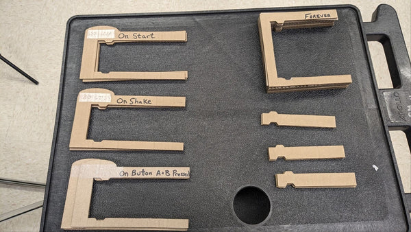 Cardboard code blocks with Braille terminology.