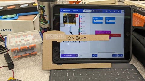 Cardboard code blocks with Braille terminology.