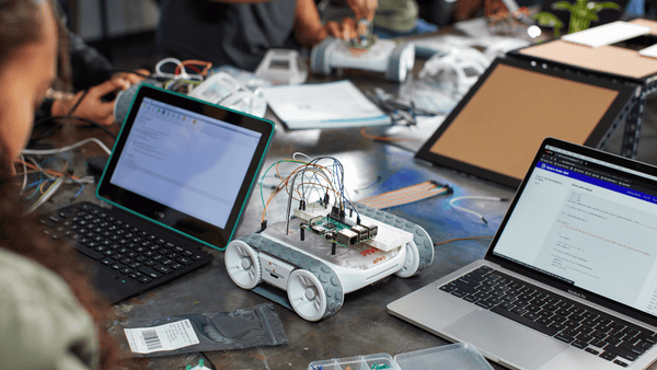 Students program a RVR+ robot with a Raspberry Pi on top of it.
