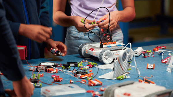 Students build an invention with littleBits on top of the RVR+ robot.