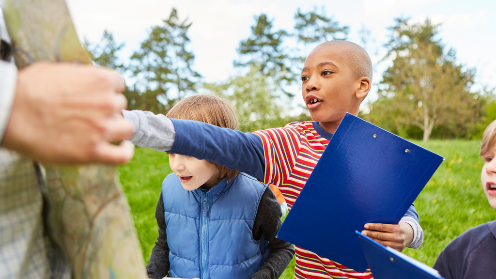 Kids learning valuable coding skills by collaborating with others.