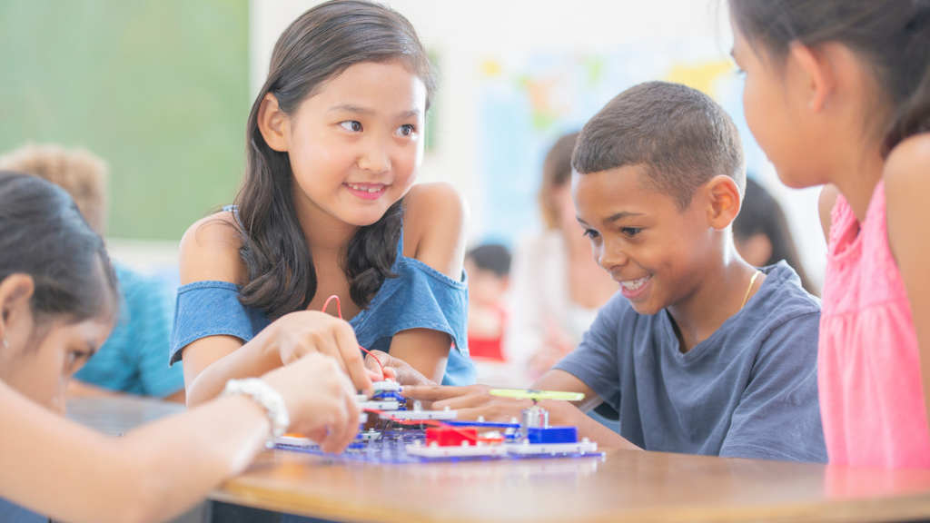 A group of students building a circuit.